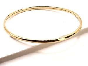 изискана  златна гривна от 14 к злато изчистен минималистичен дизайн .Гривната се отваря и има скрит механизъм за заключване . Злато проба 585